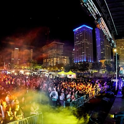 A packed crowd under the lit downtown Tampa skyline at Together As One with Bob Moses, Curtis Hixon Park, January 2026