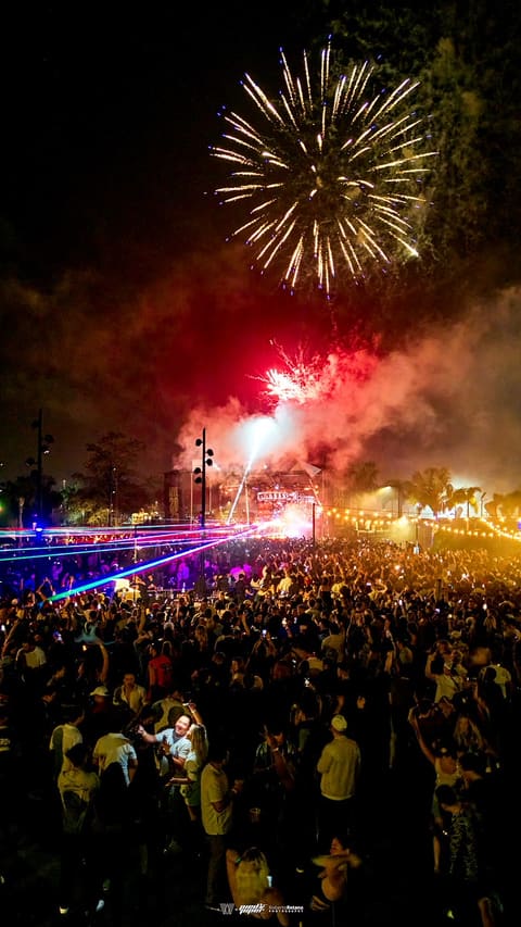 Fireworks burst above a packed crowd and stage lasers at New Year's Eve with DJ Diesel, Armature Works, Tampa, 2024