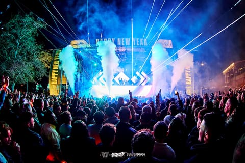 Lasers and CO2 jets fire over the crowd at the Happy New Year stage, New Year's Eve 2025 at Armature Works, Tampa